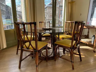 a dining room table with four chairs around it at Stunning apartment by MAS in Antwerp