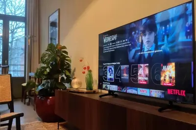 a large flat screen tv sitting on top of a table at Stunning apartment by MAS in Antwerp