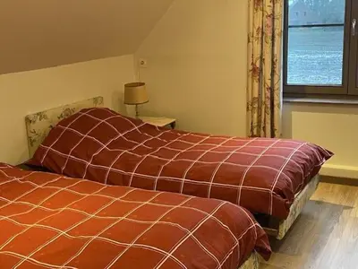 a bedroom with two beds and a window at Ahwell Guesthouse Gent 5 BR long term in Laarne