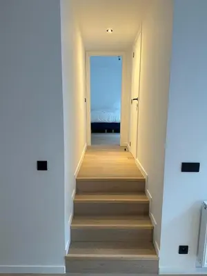 a hallway with stairs leading to a bedroom at Märch - Mechelen Goat 6 in Mechelen