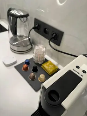 a table with a blender and some chocolates on it at Studio à Ixelles - Viaduc in Brussels