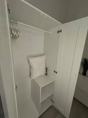 a white closet with a white pillow in it at Studio à Ixelles - Viaduc in Brussels