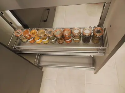 a tray of beer bottles on a shelf in a room at Bright & Cozy Appartment in Brussels in Brussels