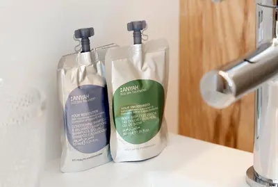 two bottles of cleaning products sitting on a counter at Happy Boutique Hotel - Grand Place in Brussels