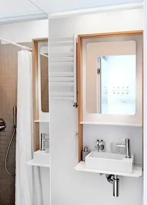 a bathroom with a sink and a mirror at Happy Boutique Hotel - Grand Place in Brussels
