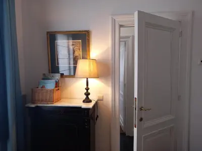 a lamp sitting on top of a dresser in a room at Holiday Home Amélie in Antwerp