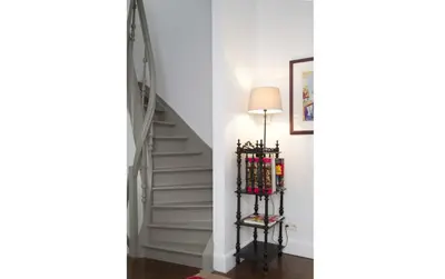 a stairway with a lamp next to a white staircase at Holiday Home Amélie in Antwerp