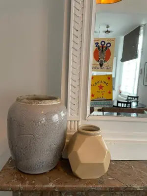 a vase sitting on a table next to a window at Holiday Home Amélie in Antwerp