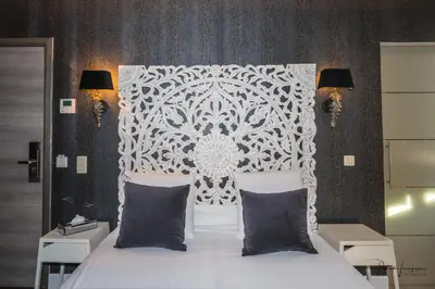 a bedroom with a white bed with two pillows at Dock 29 in Antwerp