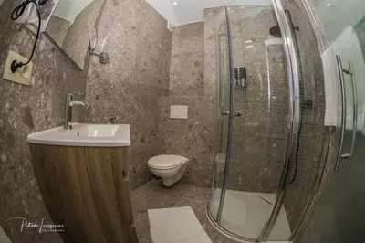 a bathroom with a shower and a sink and a toilet at Dock 29 in Antwerp