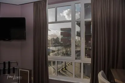 a room with a window with a view of a city at Dock 29 in Antwerp