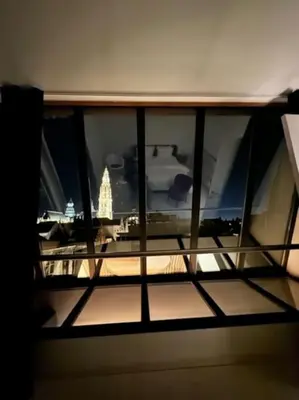 a view of a window with a view of a city at The View in Antwerp