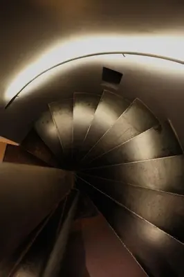 an overhead view of a metal spiral staircase at The View in Antwerp