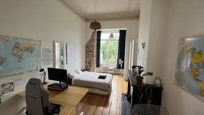 a room with a bed and a desk with a computer at Arti Appart Louise/Flagey/Centre in Brussels