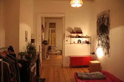 a hallway of a living room with a kitchen and a living room at Arti Appart Louise/Flagey/Centre in Brussels