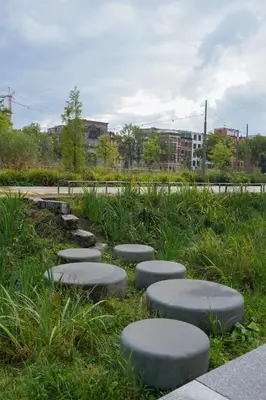 a park with stepping stones in the grass at Classy 1BR Apartment Overlooking a Beautiful Park in Antwerp