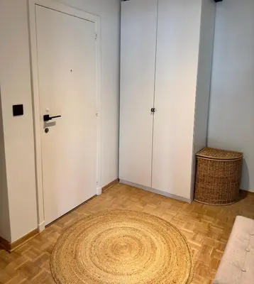 a room with a door and a rug on the floor at Cosy apartment in Ghent in Ghent