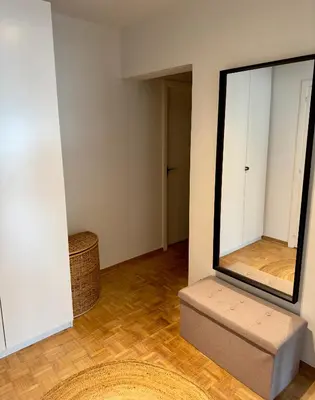 a room with a large mirror on the wall at Cosy apartment in Ghent in Ghent