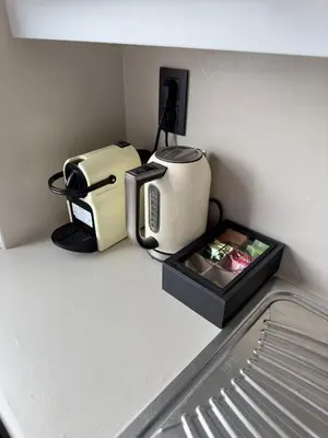 a kitchen counter with a coffee maker and a toaster at Cosy apartment in Ghent in Ghent