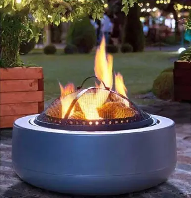 a fire pit sitting on the ground with flames at Jungle Magic Room near Atomium , Heyzel Stadium in Strombeek-Bever