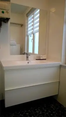 a bathroom with a sink and a mirror at Almost White, Near Train, Metro n7688 in Brussels