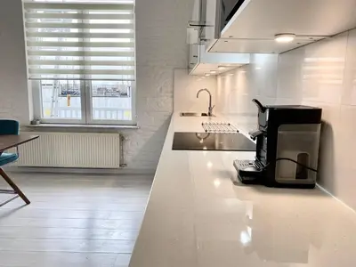 a kitchen with a coffee maker on a counter at Wit II, Near Metro, Train n7670 in Brussels