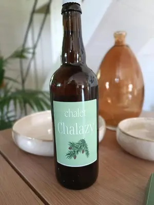 a bottle of chili chalky sauce sitting on a table at Chalet Chalazy in Lille
