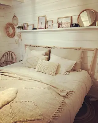 a bed with white sheets and pillows in a room at Chalet Chalazy in Lille