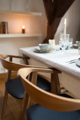 a table with two chairs and a candle on it at Chic Penthouse Grand-Place in Brussels
