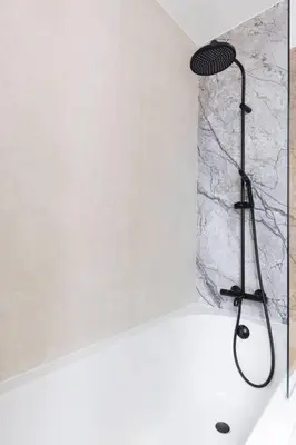 a shower with a microphone in a bath tub at Unique Flat on the GRAND PLACE in Brussels