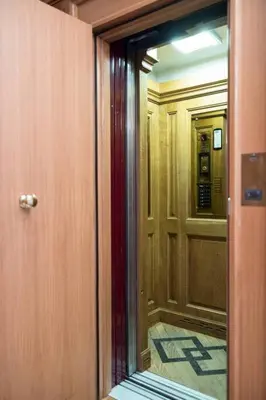 a hallway with a door and a mirror in a room at Unique Flat on the GRAND PLACE in Brussels