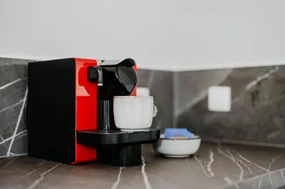 a coffee maker sitting on top of a counter at Gorgeous duplex apartment in old city centre in Antwerp
