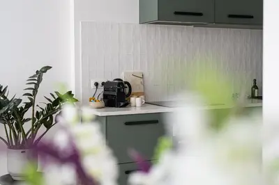 a kitchen with a counter with a toaster on it at Modern apartment in the old city center in Antwerp