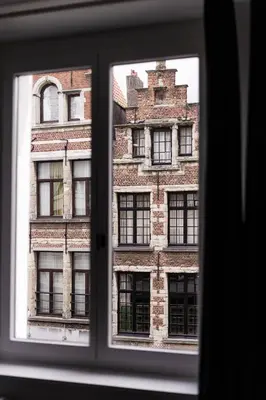 a view of a brick building from a window at Gorgeous getaway in the old city centre of Antwerp in Antwerp