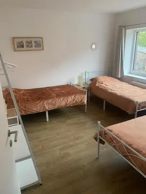 a room with two bunk beds and a mirror at Bubbles and More Guesthouse in Begijnendijk