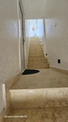 an empty hallway with stairs in a building at Casa Luca in Grimbergen