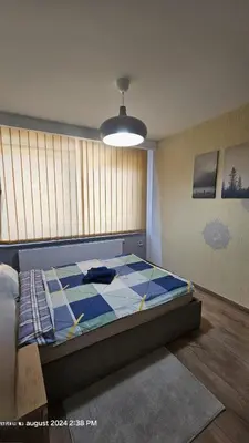a bedroom with a large bed in a room at Casa Luca in Grimbergen