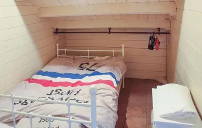a small room with a bed in a house at 2 Bedroom Cozy Home In Arendonk in Arendonk