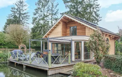 a house on a dock on the water at 2 Bedroom Cozy Home In Arendonk in Arendonk