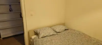 a bedroom with a bed with two pillows on it at Worker's Lodge - 2 Bedrooms & Court yard - Antwerp Smooth Stays in Antwerp