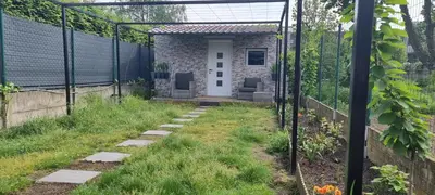 a garden with a pergola and a house at Studio Alex in Ghent