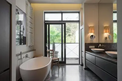 a bathroom with two sinks and a large tub at 1000m2 villa with indoor pool in Brussels