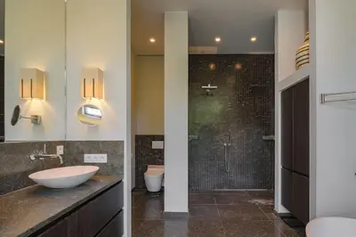 a bathroom with a sink and a shower at 1000m2 villa with indoor pool in Brussels