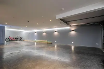 a large empty room with a bike parked in it at 1000m2 villa with indoor pool in Brussels