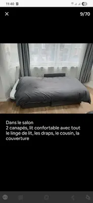 a bed in a room with a window with a bedsheet at Modern Apartment in Molenbeek-Saint-Jean / 77 m² / Parking in Brussels