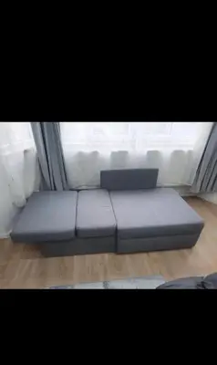 a blue couch in a room with a window at Modern Apartment in Molenbeek-Saint-Jean / 77 m² / Parking in Brussels