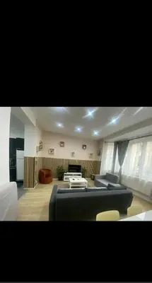 a living room with a couch and a table at Modern Apartment in Molenbeek-Saint-Jean / 77 m² / Parking in Brussels