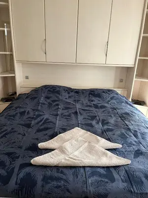 a pair of white gloves laying on a bed at Tommorowland in Niel