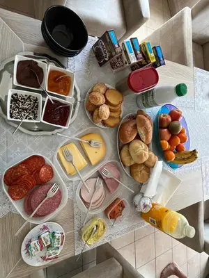 a table topped with lots of different types of food at Tommorowland in Niel