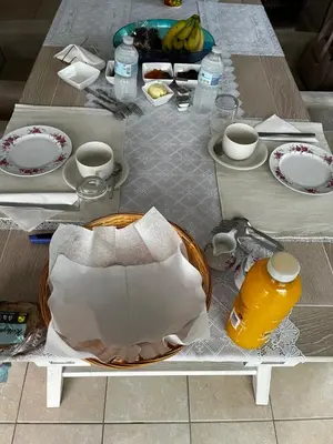 a table with plates and cups and a bowl on it at Tommorowland in Niel